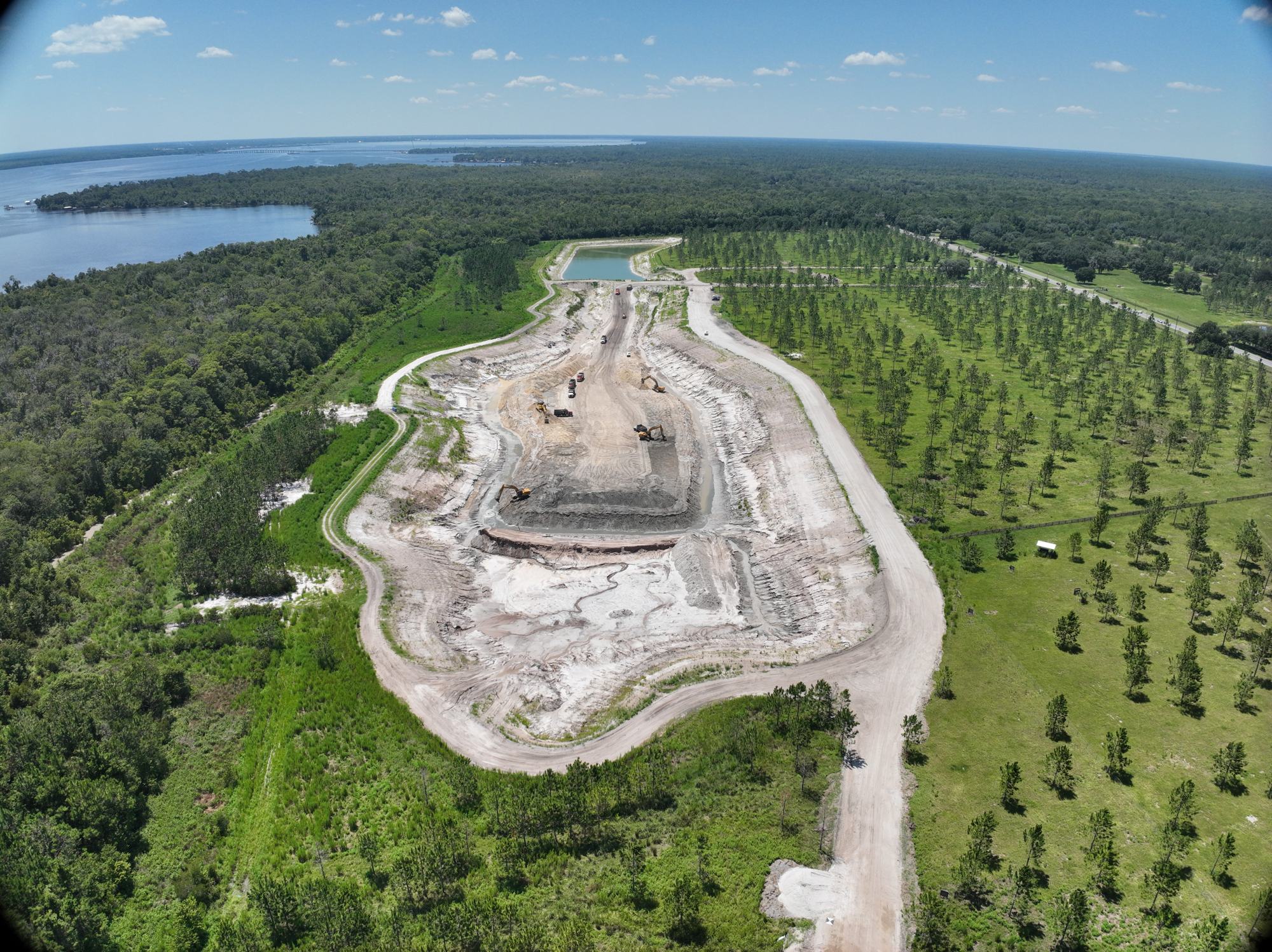 Aerial of an STC borrow pit with excavators and trucks loading out